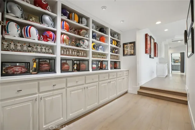 a bathroom with a granite countertop sink a toilet and a mirror