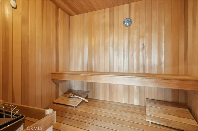 a view of a patio with couches and pool