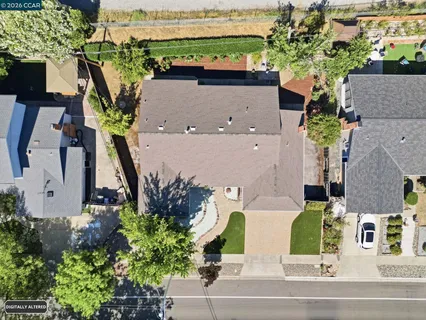 an aerial view of multiple houses with outdoor space