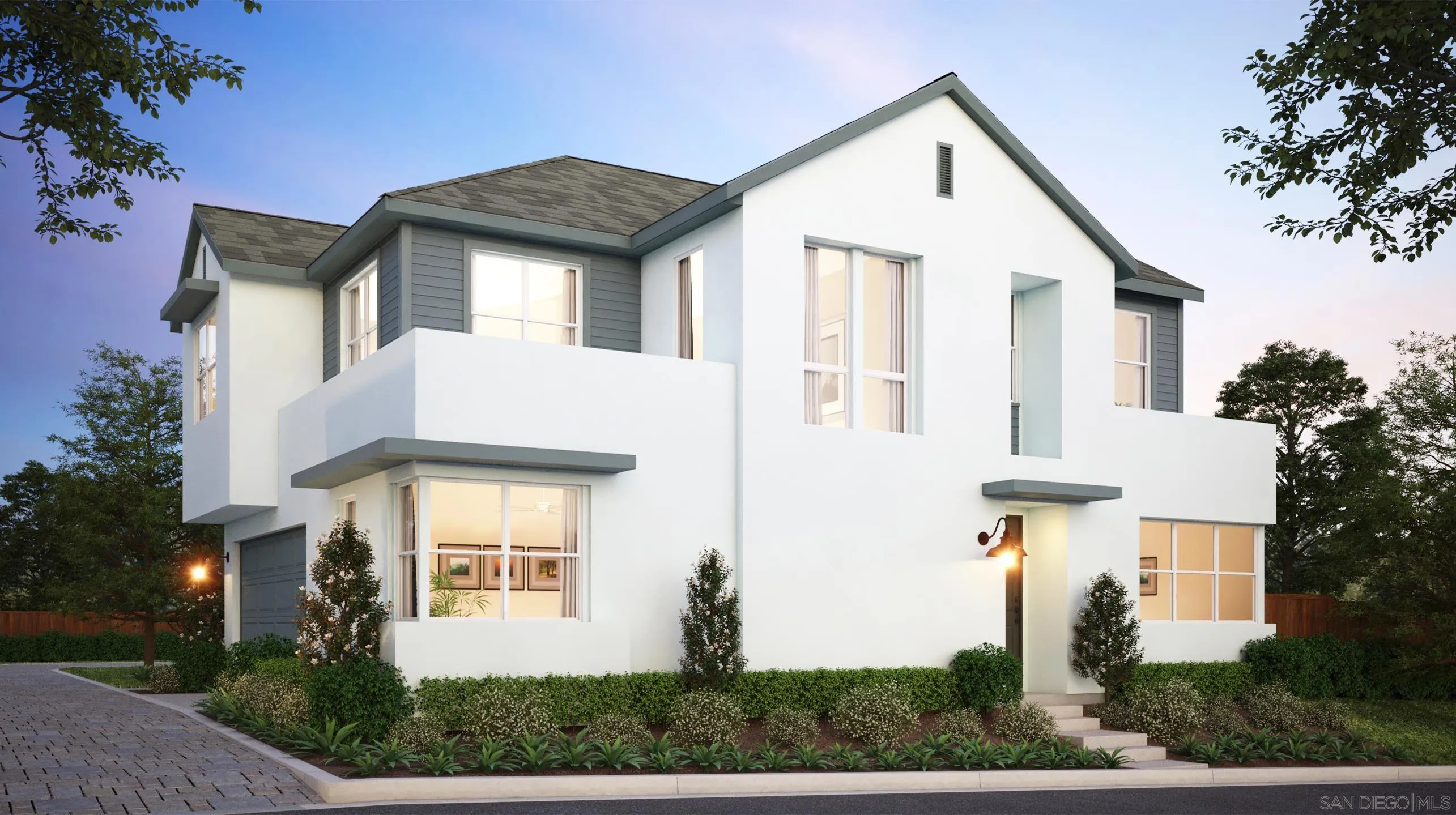 a front view of a house with a yard and trees