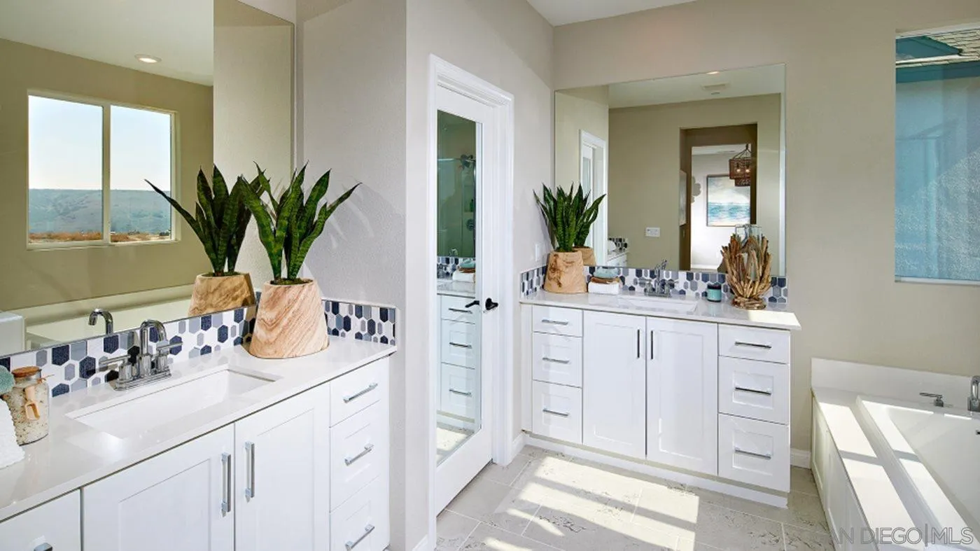 1672 Whitmore Loop, Unit HS PLAN 2 Chula Vista, CA 91913 - Photo 16 of 18 a bathroom with a sink a vanity and a mirror