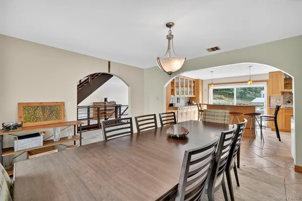 a view of dining room and hall with furniture