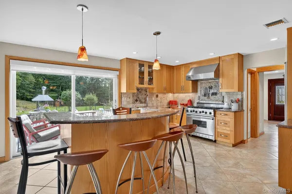 a dining room with furniture and window