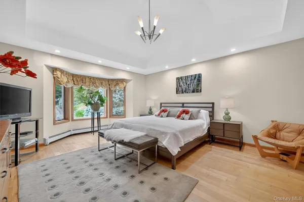 a bed room with a bed and a television