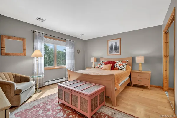 a bathroom with a shower sink and mirror