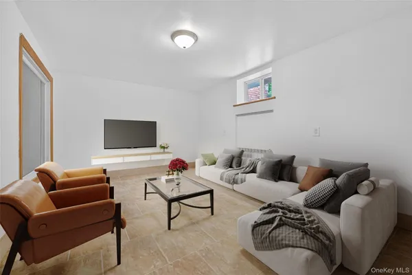 a living room with furniture and a window