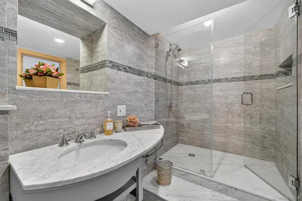 a view of a backyard with plants and chairs