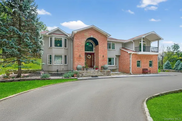 a front view of house with yard and green space