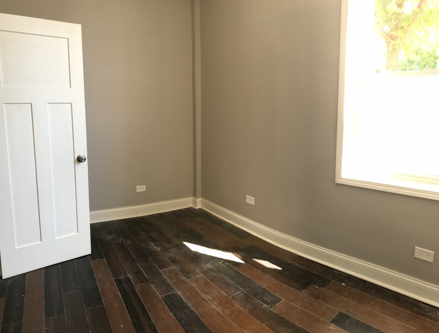 2734 West 18th Street, Unit 1F Chicago, IL 60608 - Photo 12 of 14 a view of an empty room and wooden floor