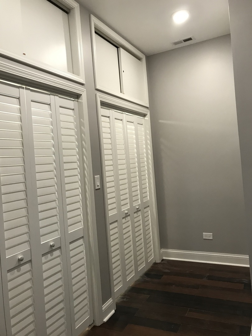 2734 West 18th Street, Unit 1F Chicago, IL 60608 - Photo 9 of 14 wooden floor in an empty room