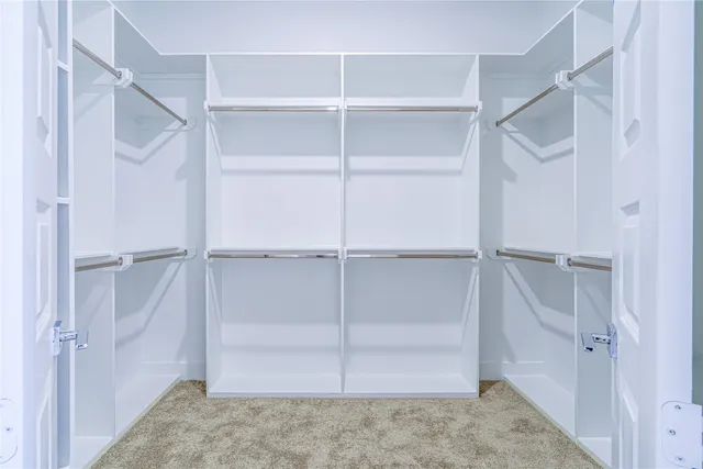 a view of an empty walk in closet
