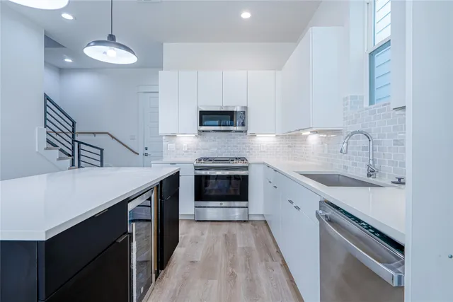 a kitchen with a stove and a sink