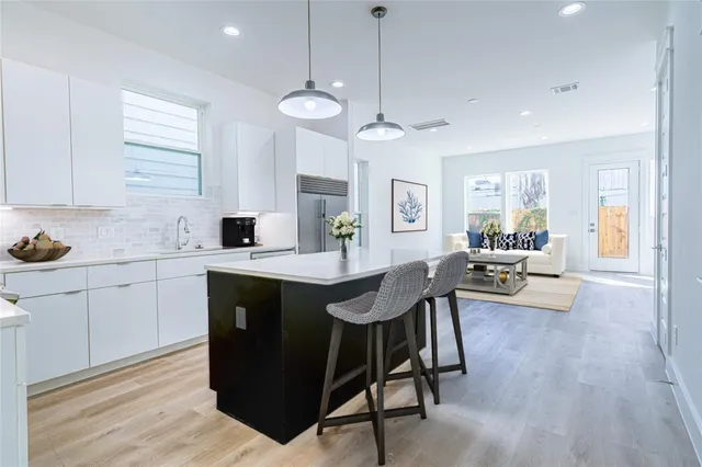 a kitchen with a counter space cabinets and appliances