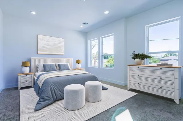 a bedroom with bed and window