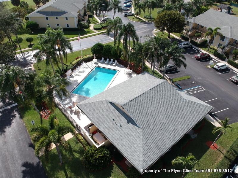 2052 Keystone Drive, Unit F Jupiter, FL 33458 - Photo 3 of 6 Community pool and club house