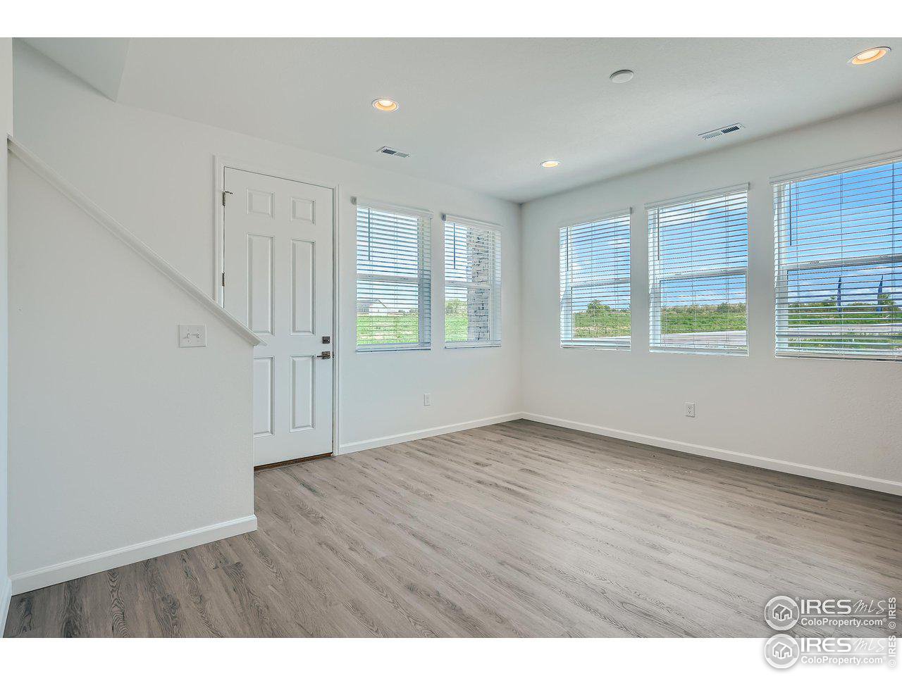 1905 Zephyr Road Fort Collins, CO 80528 - Photo 3 of 32 Lots of windows and elegant laminate floors.