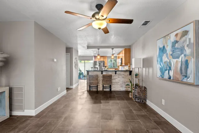 a dining room with furniture and a window