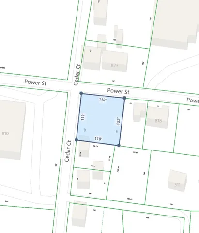 a view of a yard with a tree