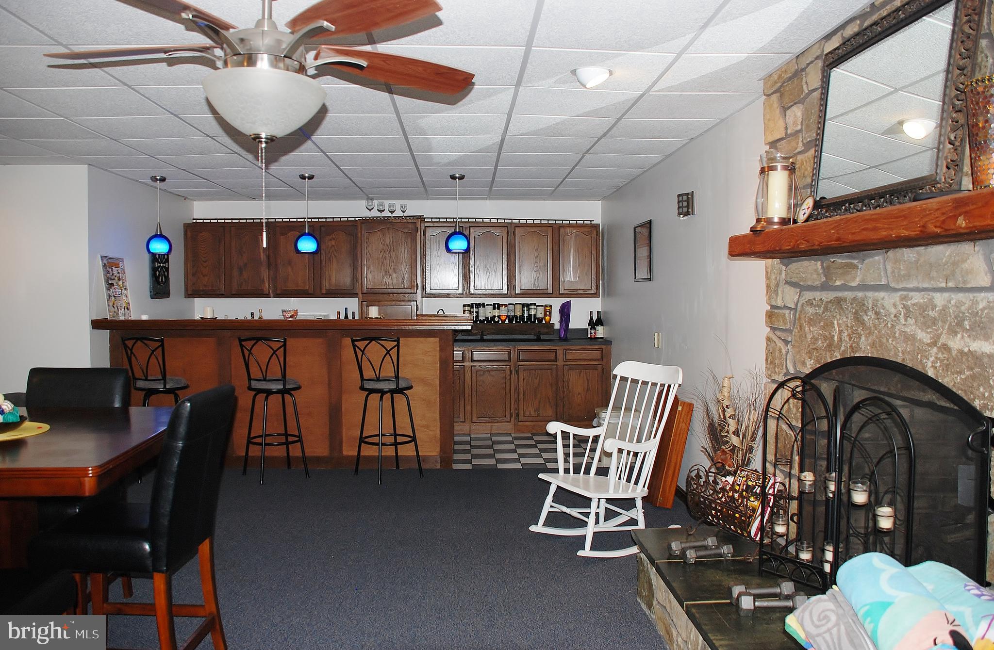 15446 Norman Road Culpeper, VA 22701 - Photo 139 of 146 Family room w/bar and stone fireplace