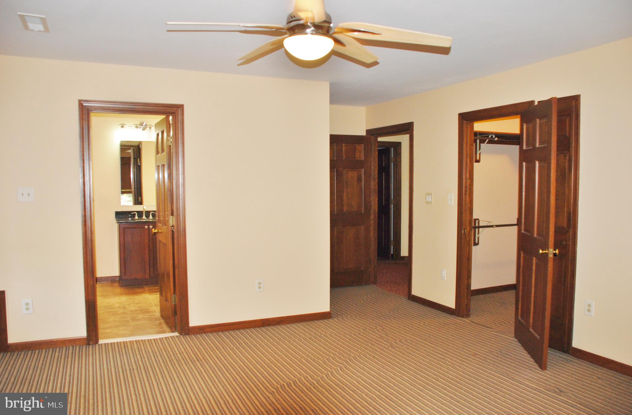 15446 Norman Road Culpeper, VA 22701 - Photo 30 of 146 Master Bedroom showing doors to bath and wi closet