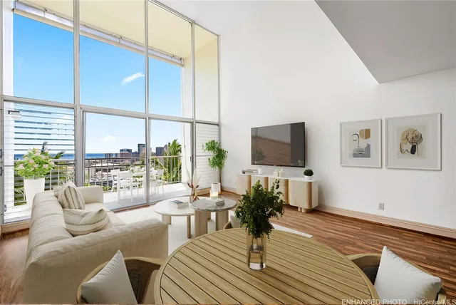 a living room with furniture a lamp wooden floor and a large window