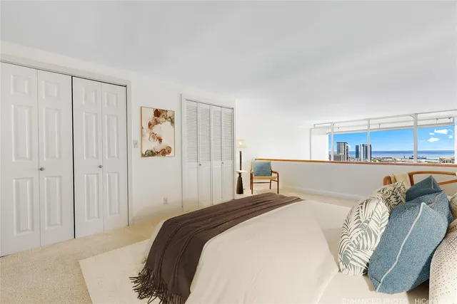 a bedroom with a bed and a couch