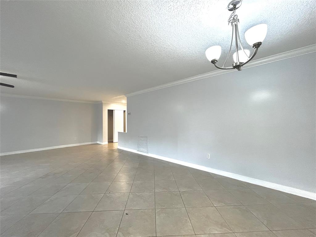 8948 Southwest 18th Road Boca Raton, FL 33433 - Photo 13 of 24 a view of an empty room with wooden floor