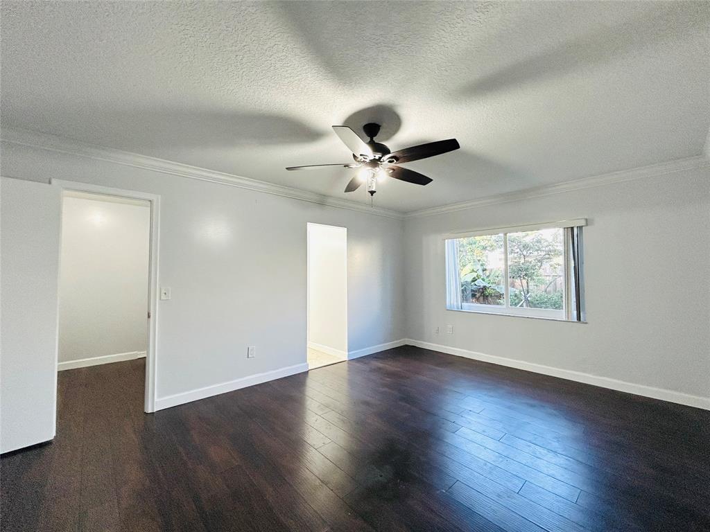 8948 Southwest 18th Road Boca Raton, FL 33433 - Photo 14 of 24 a view of an empty room with wooden floor and a window