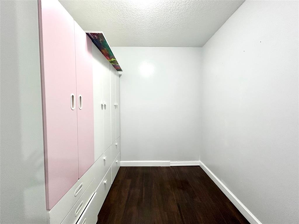 8948 Southwest 18th Road Boca Raton, FL 33433 - Photo 19 of 24 a view of a hallway with wooden floor and entryway