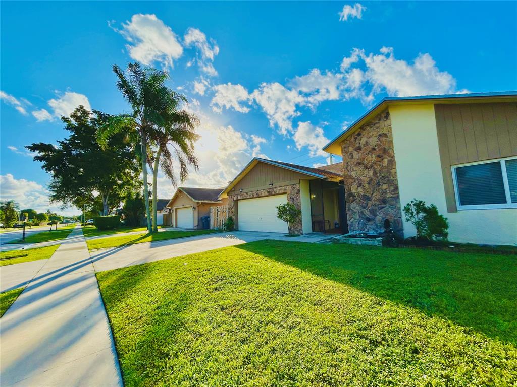 8948 Southwest 18th Road Boca Raton, FL 33433 - Photo 24 of 24 a view of a house with a swimming pool