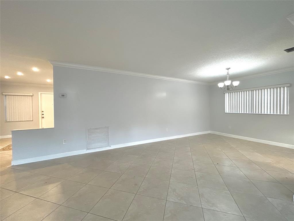 8948 Southwest 18th Road Boca Raton, FL 33433 - Photo 6 of 24 a view of an empty room with a window