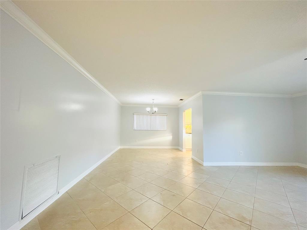 8948 Southwest 18th Road Boca Raton, FL 33433 - Photo 9 of 24 a view of an empty room with a window