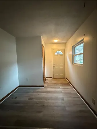 a view of an empty room and window