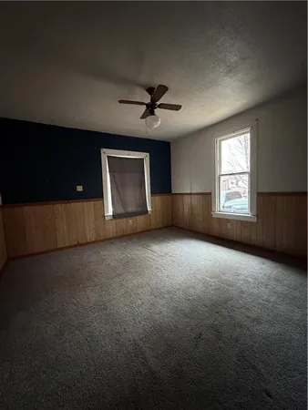 an empty room with a empty space and windows