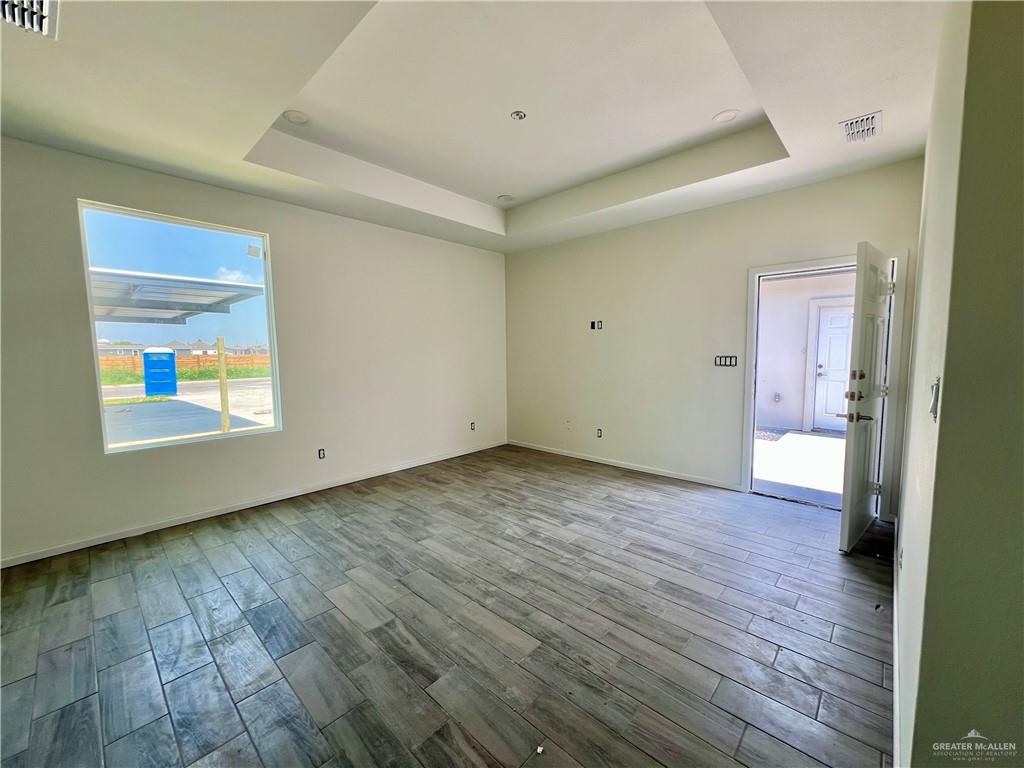 1821 Monaco Drive, Unit 2 San Juan, TX 78589 - Photo 13 of 16 a view of an empty room and wooden floor