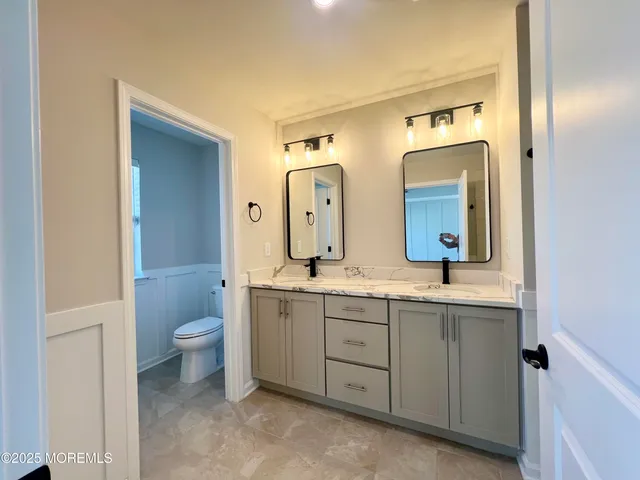 a bathroom with a glass shower door