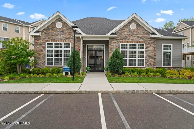a kitchen with a table chairs refrigerator and microwave