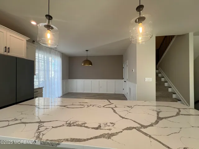 a view of a hall with a couch