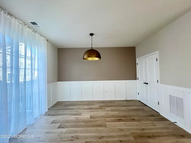 a view of a livingroom with wooden floor