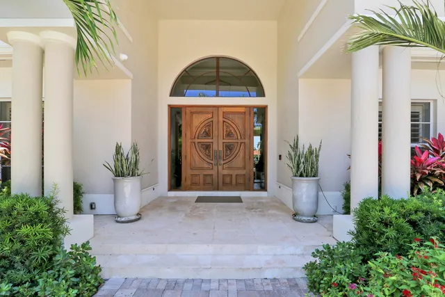 a room with lots of furniture and a chandelier