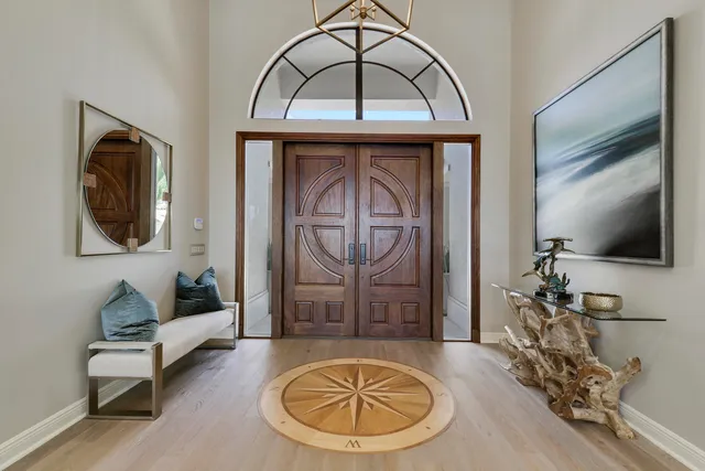 a very nice looking room with a large window and chandelier