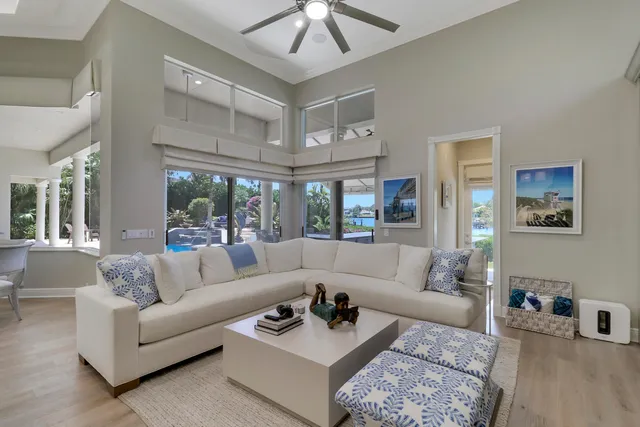 a spacious bedroom with a bed and a flat screen tv