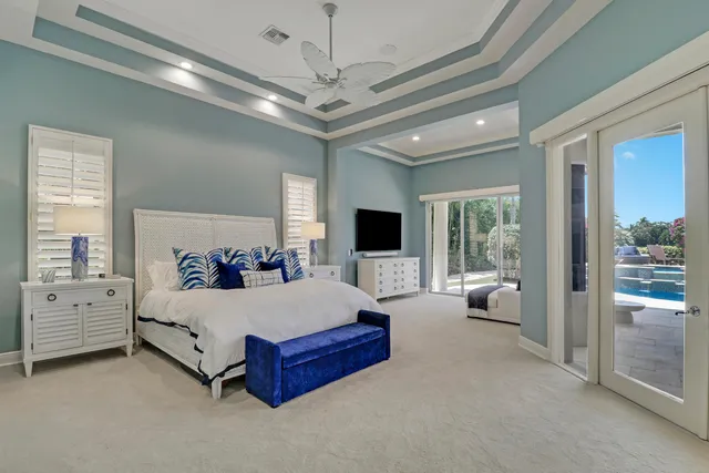 a spacious bathroom with a double vanity sink a mirror and a shower