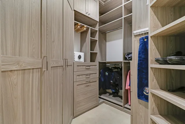 a bathroom with a granite countertop sink toilet a mirror and shower