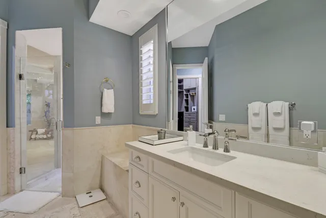 a living room with stainless steel appliances kitchen island granite countertop furniture and a rug