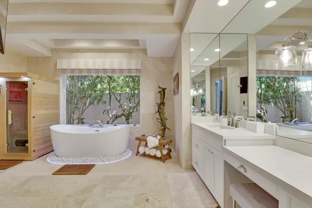 a view of a patio with table and chairs and potted plants