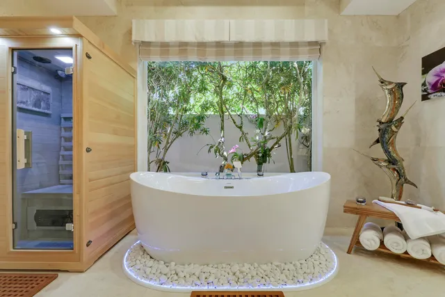a view of a chairs and table on the deck