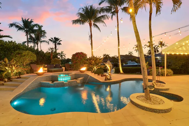 a living room with furniture a flat screen tv and a large window