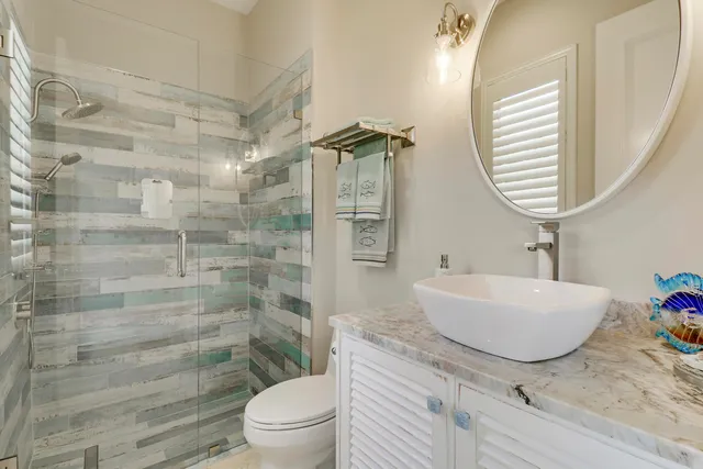 a front view of a house with swimming pool having outdoor seating