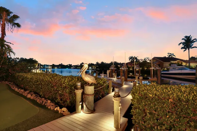 a living room with fireplace furniture and a large window
